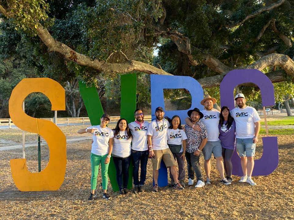 Volunteers in front of the Giant letters
